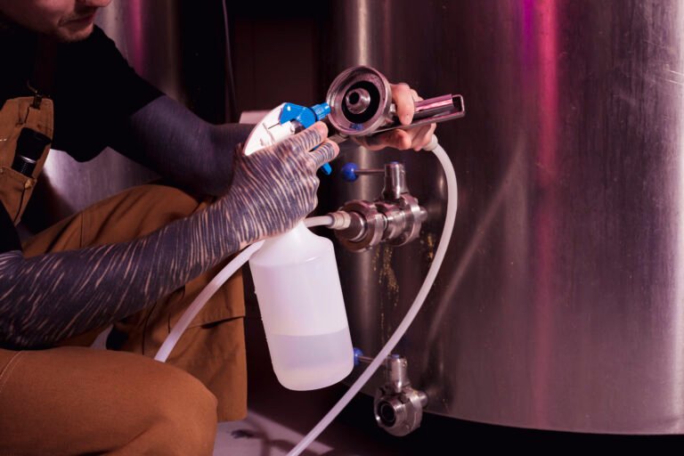 man-with-tattoos-producing-craft-beer